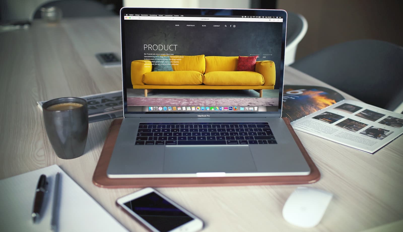 A website open on a laptop on a wooden desk